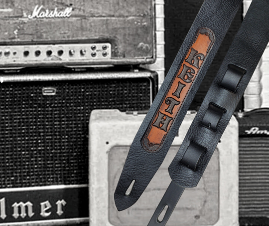 Nothing is more classic than Solid Black. "The CASH" Guitar Strap is just that it's made from 1/8" thick drum dyed vegetable tanned cow hide and has a smooth, glossy finish.  The main strap is made from a single strip of leather with beveled and painted edges.  Choose a 2" or 2 1/2" wide strap with a classic adjustment style. Made just outside Nashville in Smyrna, TN.