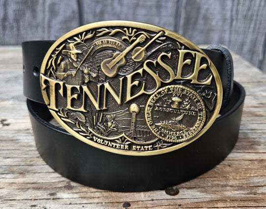 This Tennessee Belt with Montana Silversmith Buckle makes a great Combo. Features a 1 1/2" strap. Choose color: Distressed Brown or Black. The edges are beveled and finished. Available lengths from 34" to 44". The buckle is an Antiqued brass colored Tennessee State Buckle snapped in place. Belt is handmade in our shop in Smyrna, TN, just outside of Nashville