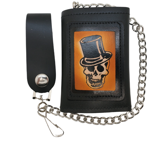Skull Top Hat all leather Tri-fold Chain Wallet. 1 Cash Slot for all your important stash, 3 card slots and 1 underneath the middle slot. It's&nbsp;USA made&nbsp;and Buckle and Hide approved. Approx. 3"x 4" folded. 2 snap closure. Complete with an 12" chrome plated chain including leather belt loop. Available in our Smyrna, TN shop a short drive from downtown Nashville. Like most wallets&nbsp;over stuffing&nbsp;will limit the time of use. Colors may vary from picture.&nbsp;