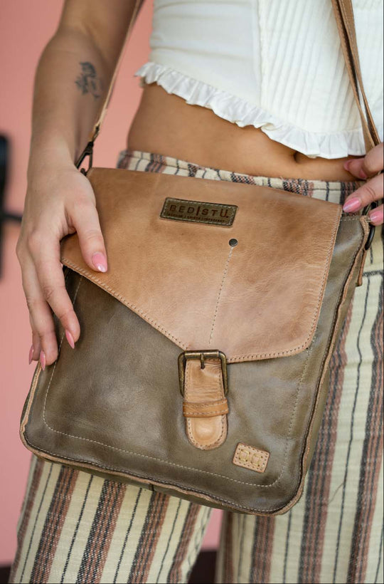 The Venice Beach is cut from full-grain, vegetable-tanned leather, its structured flap and buckle detail lend a sense of intention to an otherwise relaxed silhouette. The adjustable strap allows for effortless crossbody wear, keeping movement natural and unencumbered. The inside interior keeps daily essentials in place. Equal parts practical and expressive, Venice Beach feels at home wherever the day leads. See this awesome bag at our Smyrna, TN shop not far from Franklin.