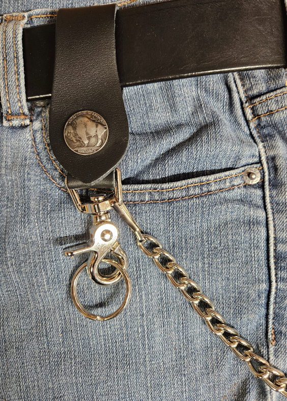 This Vintage style Steel Chain with a classic Buffalo Nickel Concho. Simple but Sturdy and will keep your wallet where it needs to be. The Leather loop, decorated with a Buffalo Nickel, attaches to your jeans and the split ring attaches to your wallet. Chrome plated. Ride down and get yours in our shop just outside Nashville in Smyrna, TN.

18" Chain Length
Leather belt tab