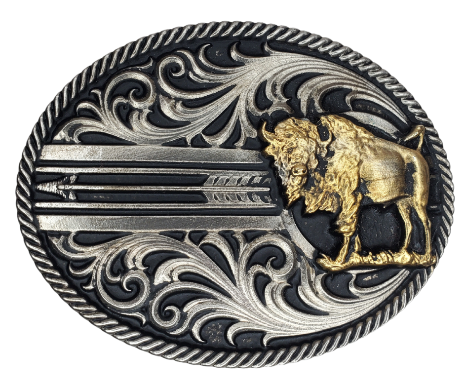 The Buffalo is a Western icon and a timeless classic imagery of the Native Americans.  Scroll pattern, a rope edge with a arrow ties it all together. Antiqued silver finished oval and plated Buffalo Attitude buckle. Fits a 1 1/2" belt and is approx. 3" x 4" in size. Available online and at our shop just outside Nashville in Smyrna, TN. Metal alloy with Montana Armor coating.