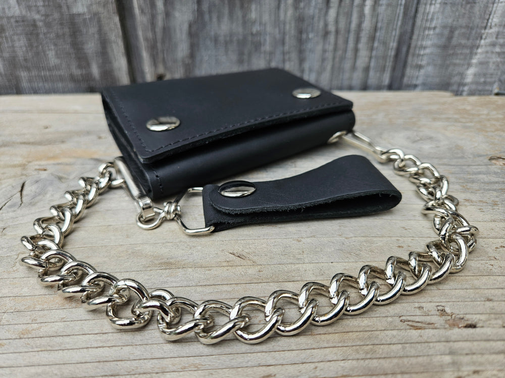 Our Bar Hopper Chain wallet is just the right amount of wallet for your night out riding your bike. It's Made in USA in a popular Tri-fold style&nbsp;with I.D. holder, 4 card slots in center section with a under pocket, zippered pocket also with a under pocket and a&nbsp;Main cash compartment. A&nbsp;12" chain keeps it's secure in a compact folded size 3 1/2" x 4 1/2" open 10 1/2" x 3 1/2". Pick yours up at our Smyrna, Tn shop not far from Murfreesboro.