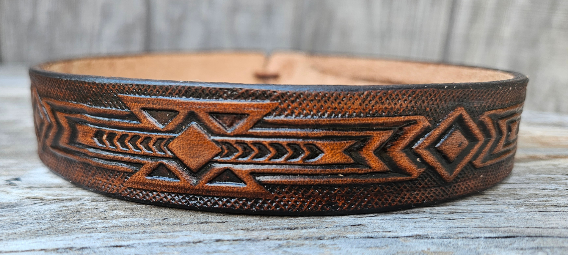 Our Brazos Western Styled Hatband is Hand Stained and 1" wide. It will up to up to size 7 1/2 hat. Fit's most any hat with adjustable bead and leather 1/8" string. Will fit most WESTERN crowned hats. Made in our Smyrna, TN. shop a short drive from downtown Nashville, TN.

1" wide
23" long (without tie string)
More colors coming soon