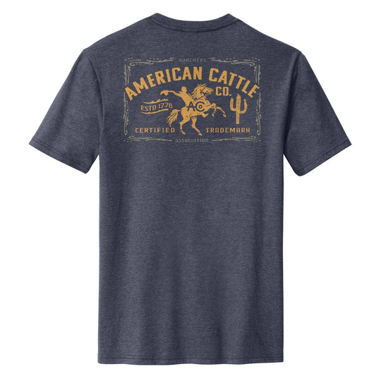 The Bucking Horse Tee from American Cattle Co. rides hard on heritage. Featuring a bold retro rodeo graphic framed in vintage lettering, it’s a nod to the grit of the arena and the cowboy spirit that built this country. This tee holds up through eight seconds or all-day wear. Available in our Smyrna TN shop not far from the Franklin Rodeo.