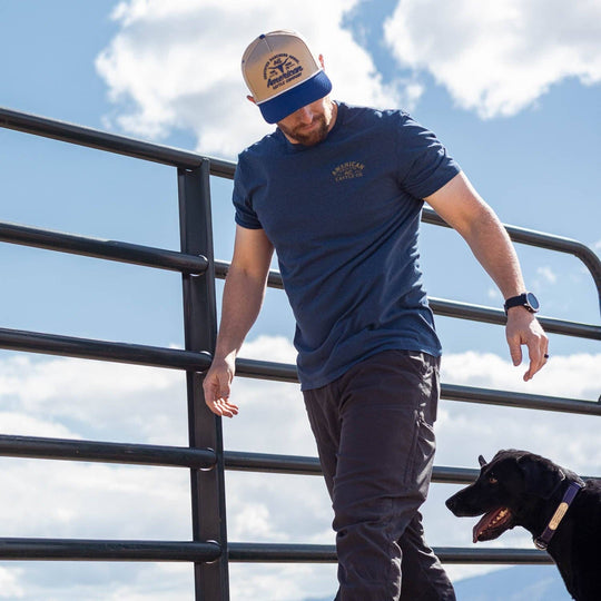 The Bucking Horse Tee from American Cattle Co. rides hard on heritage. Featuring a bold retro rodeo graphic framed in vintage lettering, it’s a nod to the grit of the arena and the cowboy spirit that built this country. This tee holds up through eight seconds or all-day wear. Available in our Smyrna TN shop not far from the Franklin Rodeo.