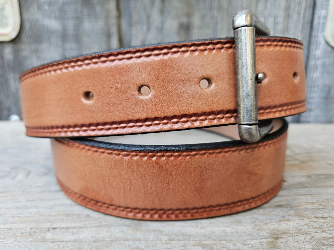 Close-up of Burywood leather belt embossed oval edge pattern