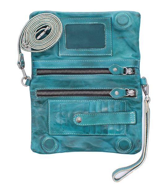 Cadence is a versatile 3-in-1 essential crafted from full-grain, Artisan vegetable-tanned leather. Effortless transitions from wallet to clutch to crossbody with a wrist strap and adjustable body strap, both are detachable. Exterior zip pocket. Sleek magnetic closure with minimalist profile. Interior has two zippered compartments, ID window, and 6 card slots. Measures 8" L x 5" H x 1.5" D. Handmade and hand-finished in León, Mexico. Made by Bed/Stu and now stocked at our Smyrna, TN store.