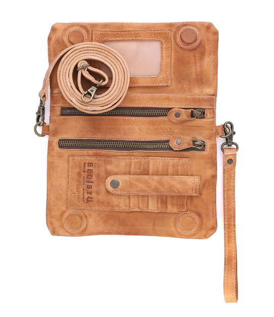 Cadence is a versatile 3-in-1 essential crafted from full-grain, Artisan vegetable-tanned leather. Effortless transitions from wallet to clutch to crossbody with a wrist strap and adjustable body strap, both are detachable. Exterior zip pocket. Sleek magnetic closure with minimalist profile. Interior has two zippered compartments, ID window, and 6 card slots. Measures 8" L x 5" H x 1.5" D. Handmade and hand-finished in León, Mexico. Made by Bed/Stu and now stocked at our Smyrna, TN store.