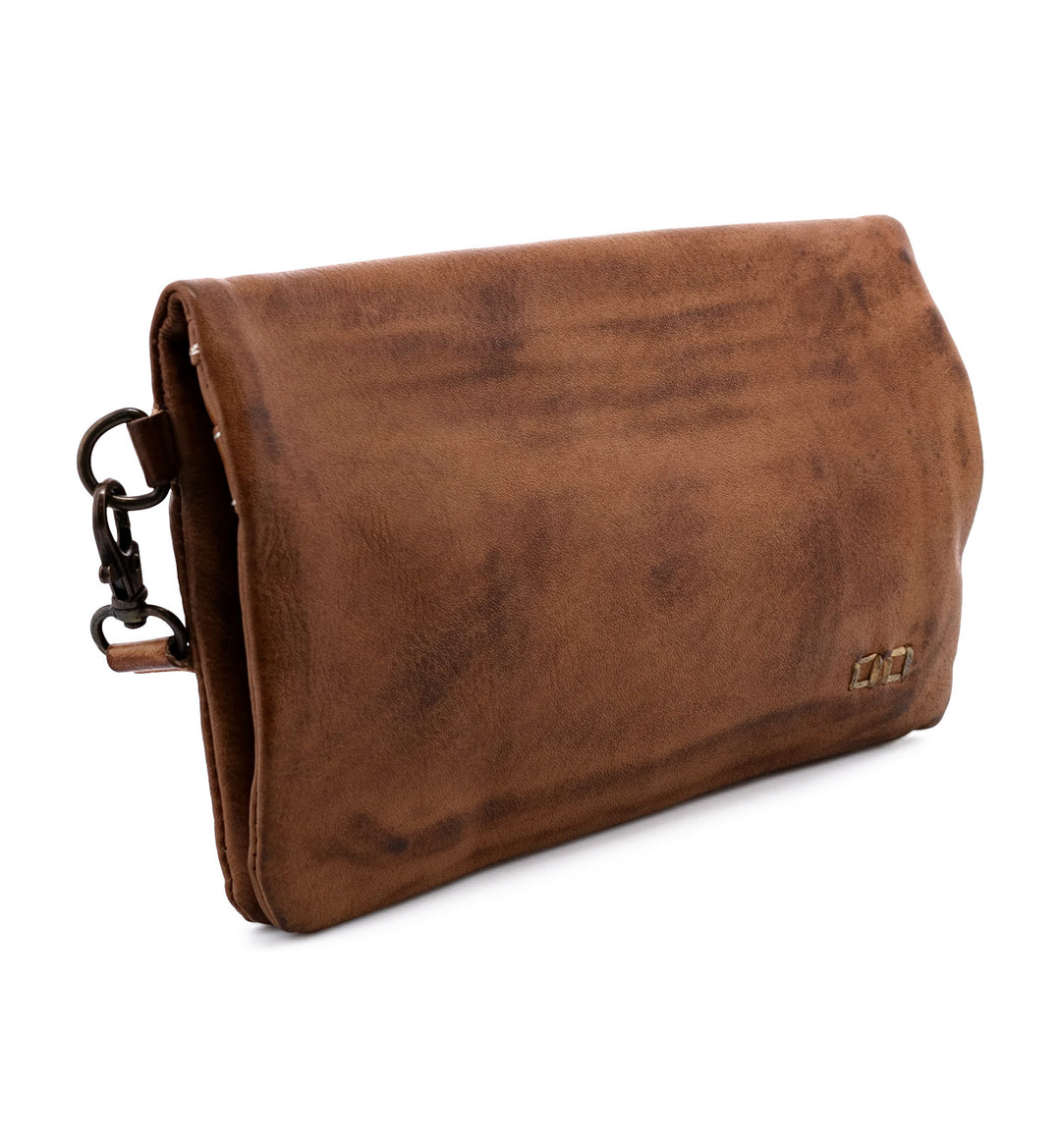 Cadence is a versatile 3-in-1 essential crafted from full-grain, Artisan vegetable-tanned leather. Effortless transitions from wallet to clutch to crossbody with a wrist strap and adjustable body strap, both are detachable. Exterior zip pocket. Sleek magnetic closure with minimalist profile. Interior has two zippered compartments, ID window, and 6 card slots. Measures 8" L x 5" H x 1.5" D. Handmade and hand-finished in León, Mexico. Made by Bed/Stu and now stocked at our Smyrna, TN store.