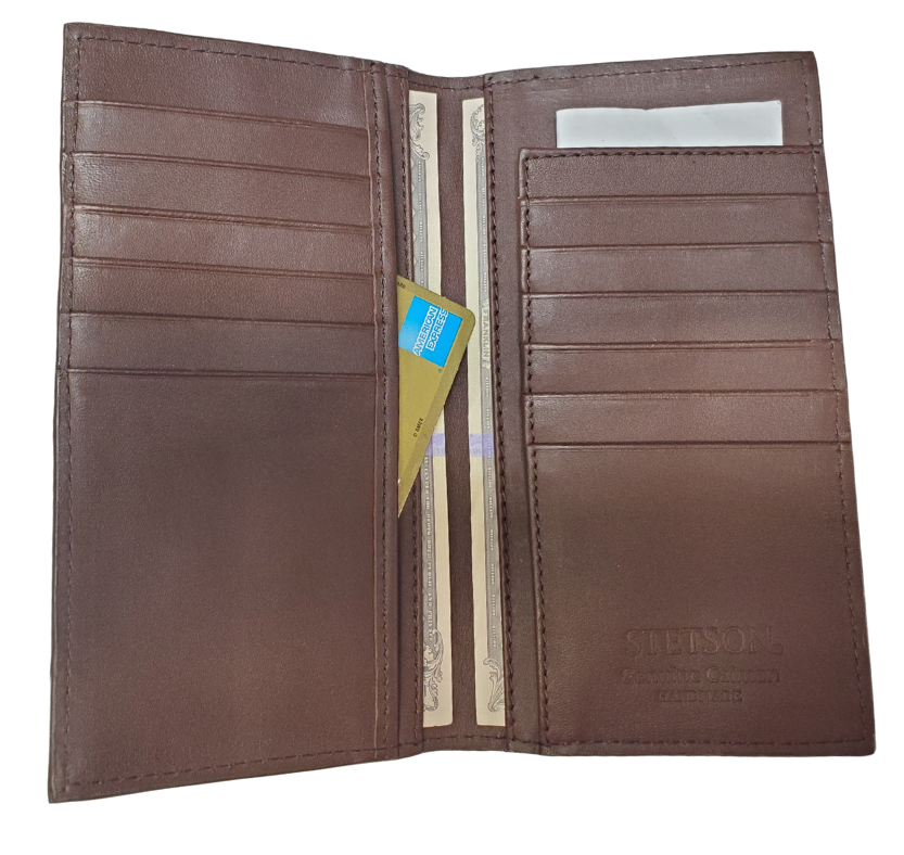 Made from authentic Caiman leather, this Long checkbook wallet blends classic western flair with bold luxury. The Stetson name guarantees top-notch craftsmanship and meticulous detail. It offers 12 card slots, 3 hidden pockets underneath, plus an outside cash slot. Available now at our Smyrna, TN store, just a quick 30-minute drive from downtown Nashville. Proudly made in Mexico.