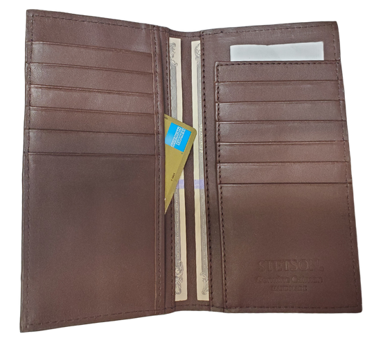 Made from authentic Caiman leather, this Long checkbook wallet blends classic western flair with bold luxury. The Stetson name guarantees top-notch craftsmanship and meticulous detail. It offers 12 card slots, 3 hidden pockets underneath, plus an outside cash slot. Available now at our Smyrna, TN store, just a quick 30-minute drive from downtown Nashville. Proudly made in Mexico.