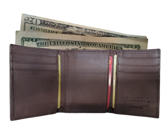 Made from authentic Black or Cigar colored Caiman leather, this bi-fold wallet blends classic western flair with bold luxury. The Stetson name guarantees top-notch craftsmanship and meticulous detail. It offers 6 card slots, 3 hidden pockets underneath, and a spacious cash compartment. Available now at our Smyrna, TN store, just a quick 30-minute drive from downtown Nashville. Proudly made in Mexico.