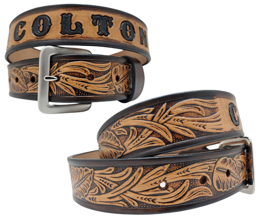 Get ready for the Rodeo adventure of The "Calgary" Name Belt! This one-of-a-kind belt features a 1 1/2" width and is hand-stained with a strip of vegetable tanned leather. The design includes a Classic Tooled Vine center pattern, while the solid brass buckle in antique nickel finish adds a touch of ruggedness. Handcrafted at our shop in Smyrna, Tennessee, just outside Nashville.