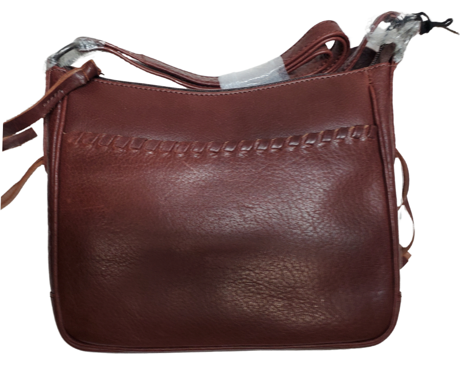 The Callie Leather Crossbody is crafted with quality full-grain leather, featuring stylish lacing on the front pocket and ends. The interior features a zippered pocket, 2 open slip pockets, another large open pocket, and a key strap for fast access to your keys. An additional zippered pocket on the back adds more room for your cell phone or other essentials. The ideal size for the lady on the go. Part of our Cary Conceal Handbags at our Smyrna, TN shop.