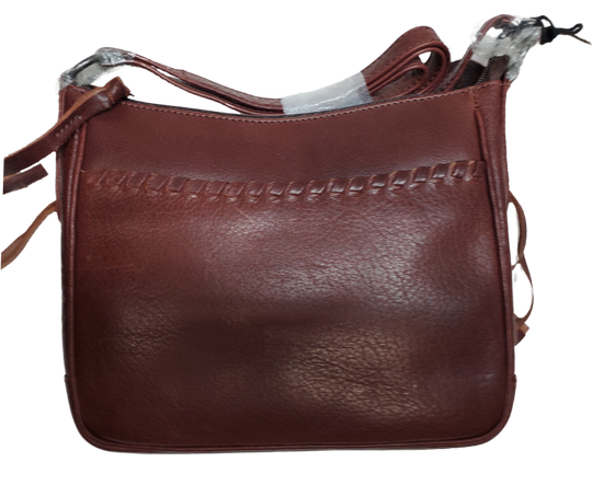 The Callie Leather Crossbody is crafted with quality full-grain leather, featuring stylish lacing on the front pocket and ends. The interior features a zippered pocket, 2 open slip pockets, another large open pocket, and a key strap for fast access to your keys. An additional zippered pocket on the back adds more room for your cell phone or other essentials. The ideal size for the lady on the go. Part of our Cary Conceal Handbags at our Smyrna, TN shop.