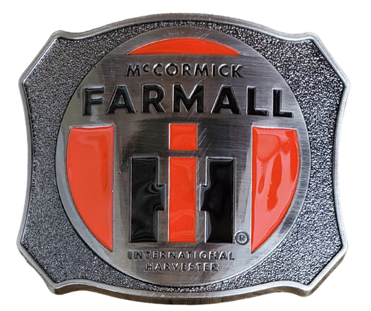 Farmall International Harvester Belt Buckle, Shield shaped with classic logo in Red, Black on antique Silver background. Size approx. 3 3/4" wide x 2 3/4" height, Fits up to 1 1/2" wide belts. Available in our shop in Smyrna, TN just outside Nashville as well as from this online store.