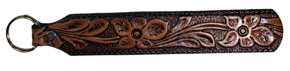 Long Leather embossed Key Fobs that are made in our Smyrna, TN shop. Longer length makes them easier to find in your bag or pocket. Choose popular Designs.

Size is 8"L x 1 1/4" Designs may vary from picture slightly