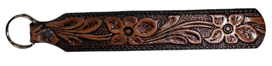Long Leather embossed Key Fobs that are made in our Smyrna, TN shop. Longer length makes them easier to find in your bag or pocket. Choose popular Designs.

Size is 8"L x 1 1/4" Designs may vary from picture slightly