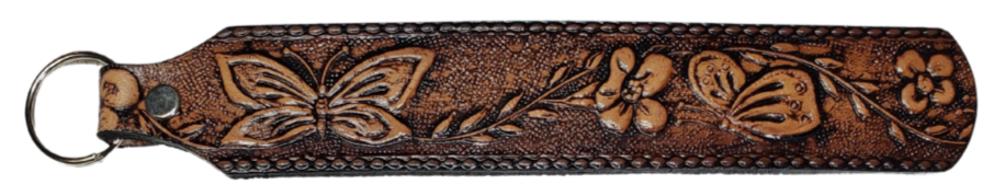 Long Leather embossed Key Fobs that are made in our Smyrna, TN shop. Longer length makes them easier to find in your bag or pocket. Choose popular Designs.

Size is 8"L x 1 1/4" Designs may vary from picture slightly