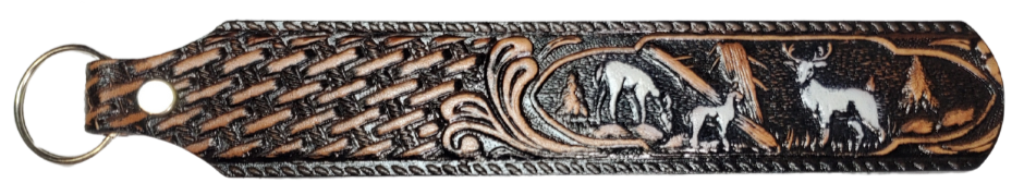 Long Leather embossed Key Fobs that are made in our Smyrna, TN shop. Longer length makes them easier to find in your bag or pocket. Choose popular Designs.

Size is 8"L x 1 1/4" Designs may vary from picture slightly