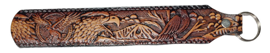 Long Leather embossed Key Fobs that are made in our Smyrna, TN shop. Longer length makes them easier to find in your bag or pocket. Choose popular Designs.

Size is 8"L x 1 1/4" Designs may vary from picture slightly
