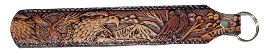Long Leather embossed Key Fobs that are made in our Smyrna, TN shop. Longer length makes them easier to find in your bag or pocket. Choose popular Designs.

Size is 8"L x 1 1/4" Designs may vary from picture slightly