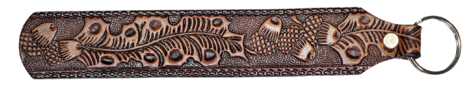 Long Leather embossed Key Fobs that are made in our Smyrna, TN shop. Longer length makes them easier to find in your bag or pocket. Choose popular Designs.
 
Size is 8"L x 1 1/4" Designs may vary from picture slightly