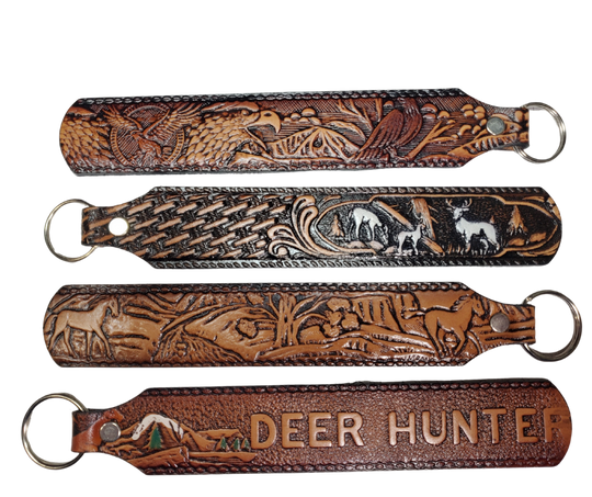 Long Leather embossed Key Fobs that are made in our Smyrna, TN shop. Longer length makes them easier to find in your bag or pocket. Choose popular Designs.

Size is 8"L x 1 1/4" Designs may vary from picture slightly