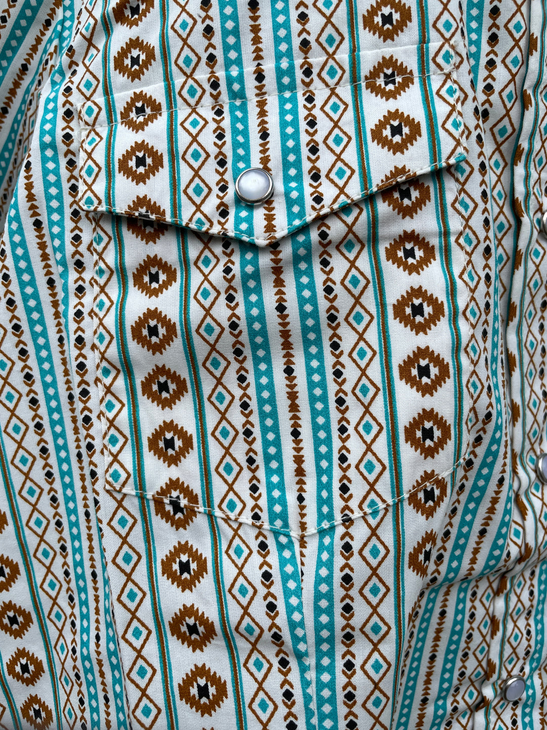 The Cowgirl Legend Ladies Southwestern Shirt offered in Sleeveless and Long Sleeve. Complete with two front flap pockets, pearl snap details in a classic southwest pattern. These are always in style! Available in our Smyrna, TN shop not far from the Miller Coliseum in Murfreesboro. Imported

Details: Pearl Snaps, 2 Pockets, Yokes, 100% Cotton