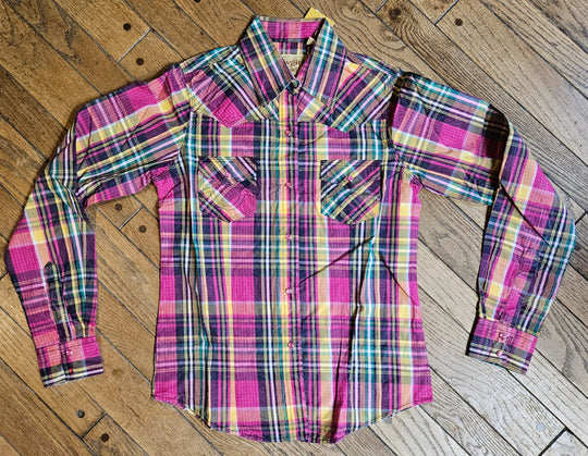 The Cowgirl Legend Ladies Spunky Plaid Shirt offered in long sleeve. A dominant hot pink is accented with yellows, whites, greens, and grays blended together in a traditional plaid pattern. Complete with two front flap pockets, and pearl snaps. These shirts are always in style,and especially if you want to keep Steve guessing what you&