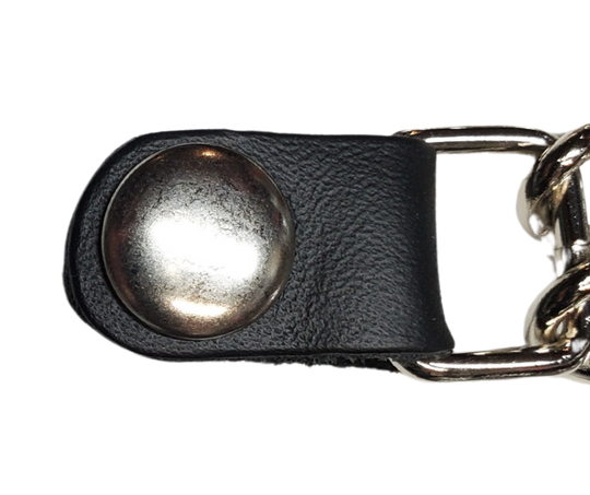 Vest Chains...a great accessory for your vest. Sure they look great but they offer some great options for your riding. In our experience most folks will use at least 2 but some will go with more, it's your choice. These options are the basic chrome plated double chain with leather ends (with exception of Single Chain). The average length is approx. 4"- 4 1/2" long. Snaps are attached with a leather folded part. Please note the ladies vests snap opposite side to the men. Each Sold Individually. 