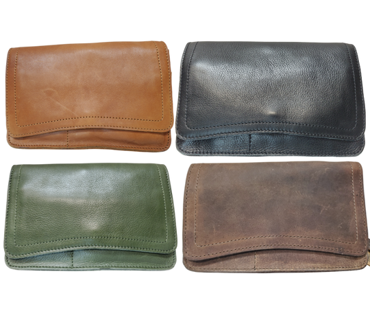 The Aubry leather handbag is available at our Smyrna, TN shop not far from Nashville. The main compartment zips closed, is lined with a sturdy fabric & has 5 inside card slots. Two stacked open pockets, a zippered pocket followed by 2 more slit pockets on the very front. All gets covered by a large flap with a magnetic clasp. On the backside of this organizers dream is yet another open pocket held in place with a narrow piece of leather with a magnetic closure.
Bag size: 8.5” x5” x 2”
54" adjustable strap 