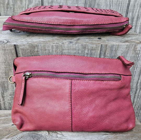 The Eve is made from soft tumbled leather and has a Woven front. The back side has a zippered pocket that will hold most smaller phone sized items. The main open inside pocket has one zippered pocket, 2 open top pockets 4 card size slots and one more smaller pocket next to to the cards. May be carried with the Wrist loop or as a Crossbody style with the included strap. The liner is a cotton fabric. Available now at our store in Smyrna, TN!

Measurements: 10" x 1" x 6"