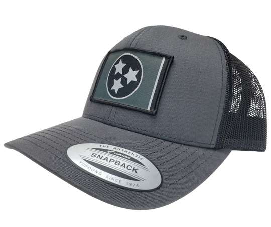 The Three stars on this Structured cap represent the three divisions of Tennessee: West, Middle and East. “They are arranged in such a way that not one star has prominence over the other. Sport your Tennessee support with our grey mesh cap featuring the iconic Tennessee Tri Star flag logo. Shop now at our Smyrna, TN store or online. Snap back adjustment.