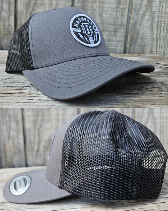 Classic Patched Cap with Music City Nashville and shape of guitar head in the center. Patch is front and center of a snapback cap. This will soon become your favorite cap! Shop now at our Smyrna, TN store or online.

snap back adjustment
Charcoal front with black mesh back