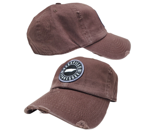 Embroidered Nashville Tennessee Patch Vintage distressed washed style 100% breathable premium cotton Pre-curved visor with 8-row stitching on visor. Matching under visor 6 panel low profile unconstructed Lightweight, durable, smooth, with a hint of stretch One size fits most, Adjustable metal buckle back closure. Shop now at our Smyrna, TN store or online.