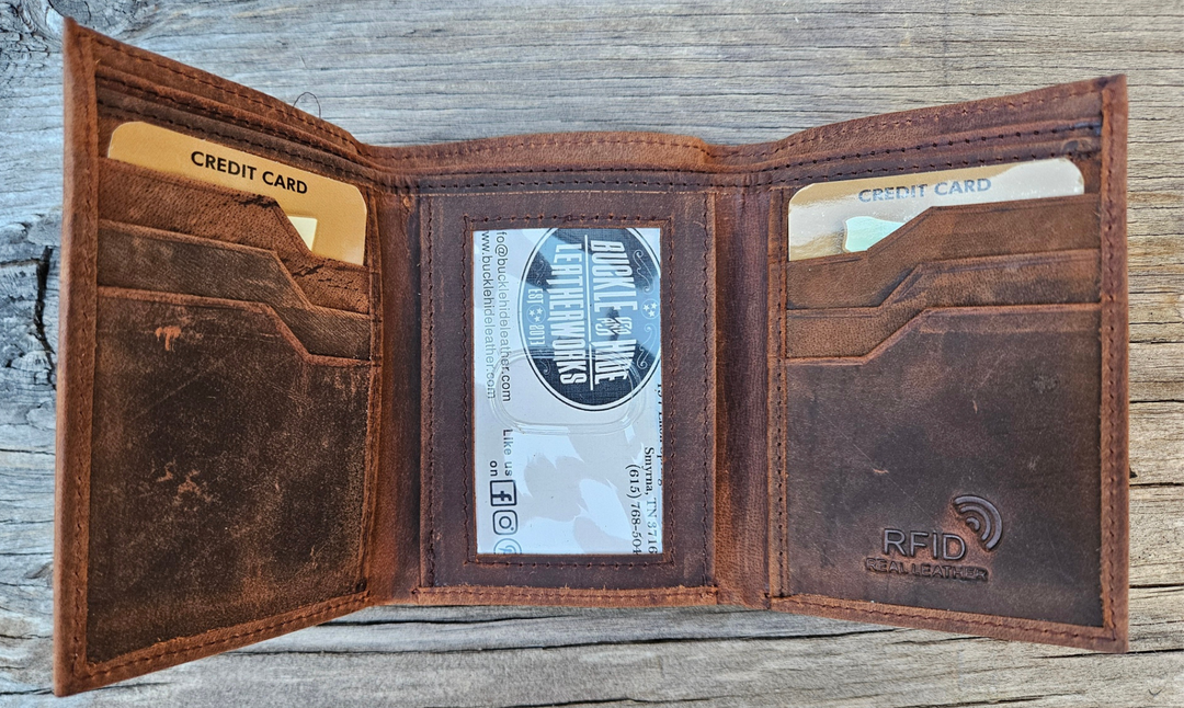 The Cooper Tri-fold leather wallet will be your daily carry. Equipped with 8 credit card slots and 1 ID window slot in the center. The main compartments has a cash divider. Lined with RFID blocking. Available in our Smyrna, TN shop near Sewarts Landing.

Made in India.
Approx. Size: 3 1/4"x 4 1/4" when closed.
