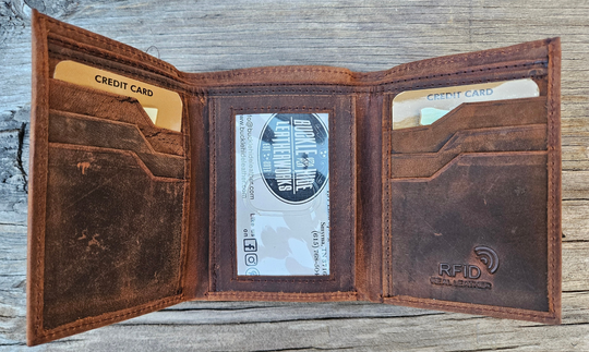 The Cooper Tri-fold leather wallet will be your daily carry. Equipped with 8 credit card slots and 1 ID window slot in the center. The main compartments has a cash divider. Lined with RFID blocking. Available in our Smyrna, TN shop near Sewarts Landing.

Made in India.
Approx. Size: 3 1/4"x 4 1/4" when closed.