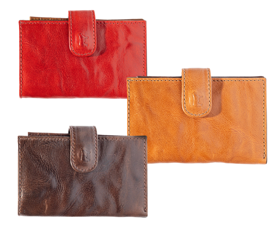 Three Corfu signature women's wallets in red, brown, and tan colors, made from vegetable-tanned Italian leather with a magnetic closure and multiple card slots.
