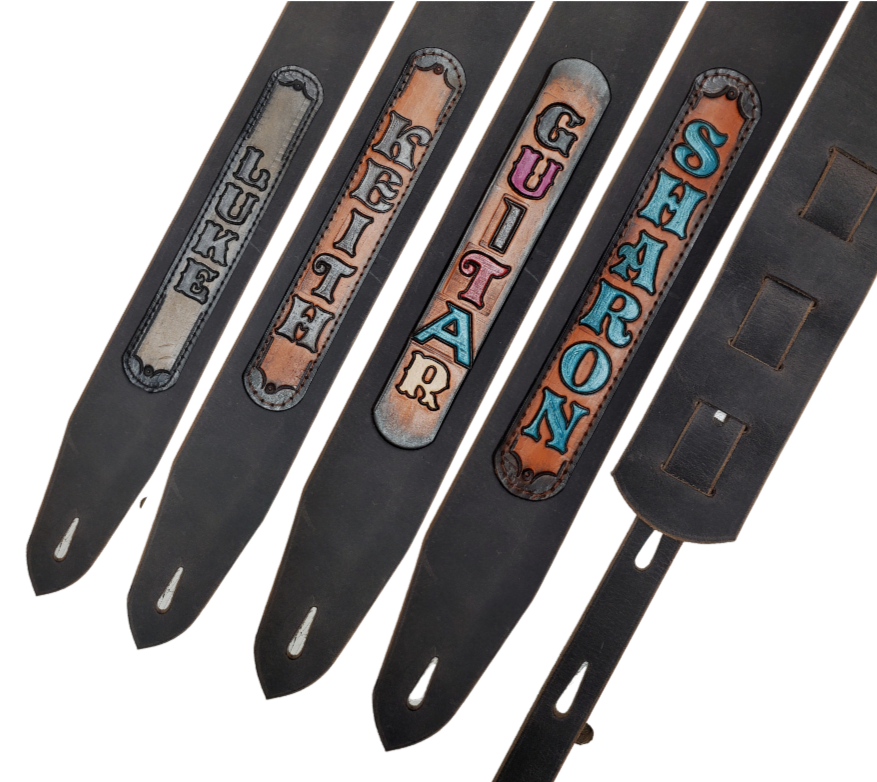 Cool Guitars, Great Songs and Lyrics have been staple for years in Country music!  "This 2" or 2 1/2" wide Guitar Strap is a nod to that classic influence. The main Body of the strap is approx. 1/8" thick Distressed Gray Leather Strap with a CUSTOMIZABLE LEATHER NAME PATCH. The classic adjustment style goes from approx. 42" to 56" at it's longest . Made just outside Nashville in our Smyrna, TN. shop. 