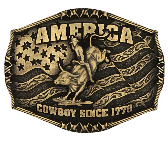 Stand for liberty and Western heritage for all with the Cowboy Since 1776 Attitude Buckle. The waving American flag provides the backdrop for the design. The word "America" sits above the bull rider figure. The words "Cowboy Since 1776" is beneath the bull rider figure. A roped border with barbed wire design creates the edge of the buckle, giving the piece a rustic look. Fits 1.5 inch belts. Find it online or at our shop just outside Nashville in Smyrna, TN.