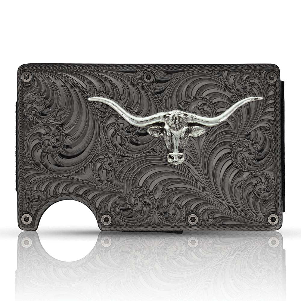 Available at our shop just outside Nashville in Smyrna, TN. Our Longhorn Bronze Credit Card Holder is a beaut! It offers a distinctive, slim design that is practical and comfortable in your hand and pocket, making it an everyday essential. One side with a bronze finished panel of Montana Silversmiths signature bright-cut engraving. The Carbon Fiber side has a clip that can hold your cash. Holder expands to hold a multitude of cards with thick elastic bands.