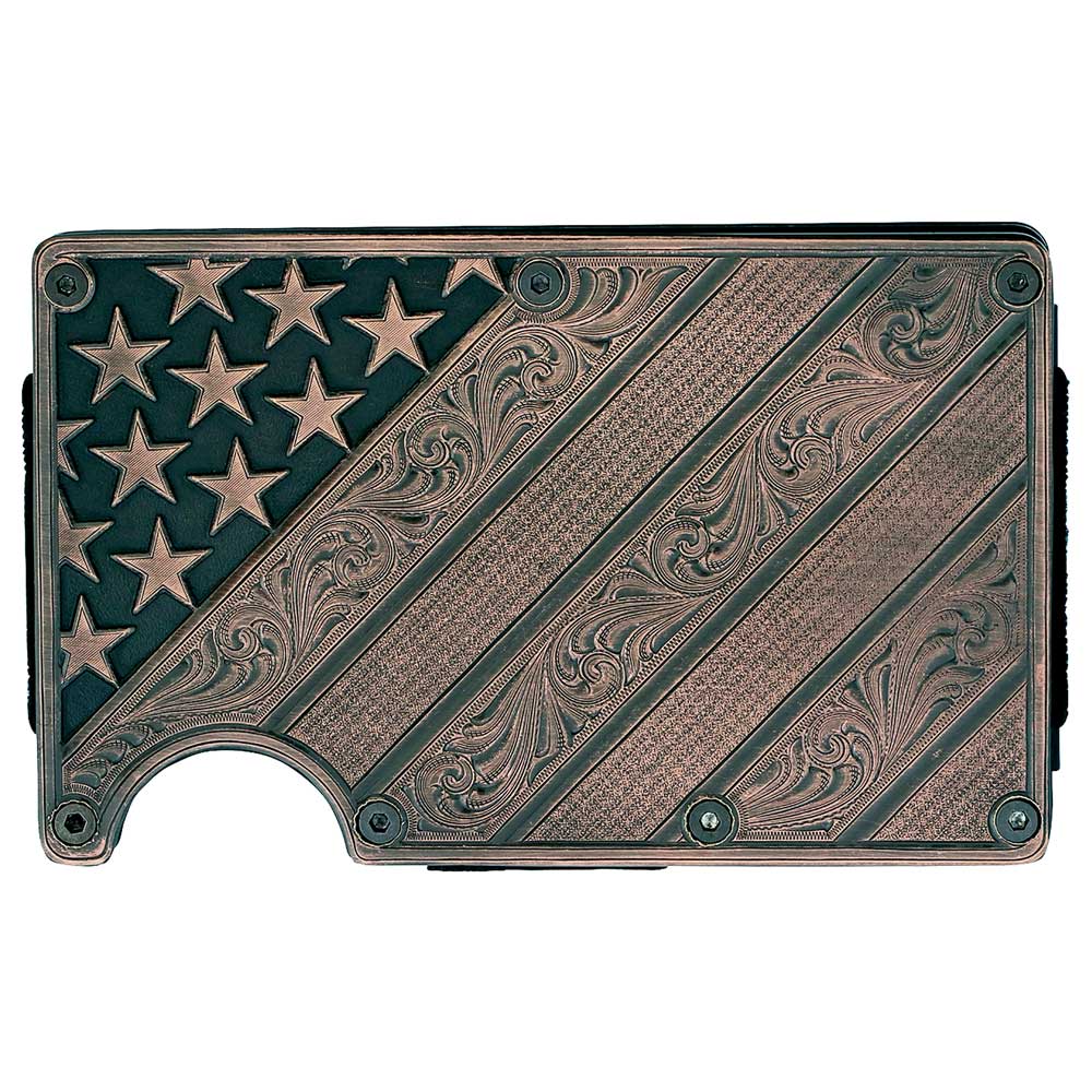 Available at our shop just outside Nashville in Smyrna, TN. Our All American Bronze Credit Card Holder is a beaut! It offers a distinctive, slim design that is practical and comfortable in your hand and pocket, making it an everyday essential. One side with a bronze finished panel of Montana Silversmiths signature bright-cut engraving. The Carbon Fiber side has a clip that can hold your cash. Holder expands to hold a multitude of cards with thick elastic bands.