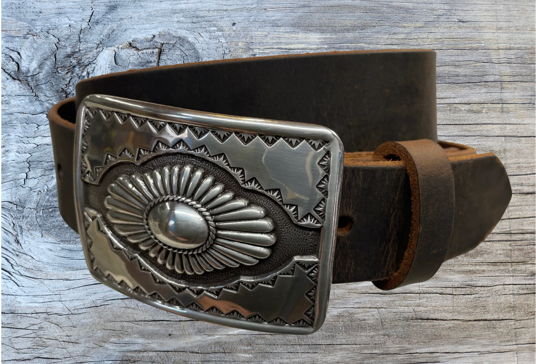 "The Cody" is a Western style belt buckle that will add a classic western look to your belt. ﻿CHOOSE ONE BELT STRIP COLOR! ﻿The belt is made from a single strip of leather in our shop in Smyrna, TN, just outside Nashville. The buckle is imported. ﻿Available in our retail and online shops. Black.