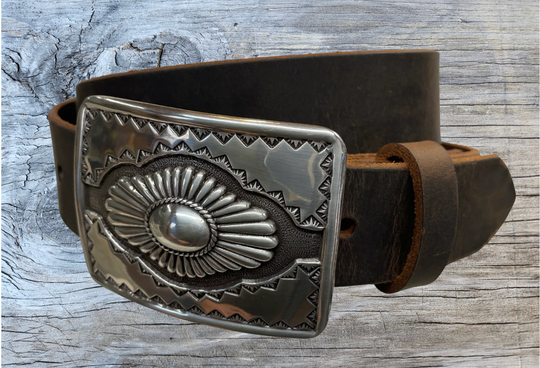 "The Cody" is a Western style belt buckle that will add a classic western look to your belt. ﻿CHOOSE ONE BELT STRIP COLOR! ﻿The belt is made from a single strip of leather in our shop in Smyrna, TN, just outside Nashville. The buckle is imported. ﻿Available in our retail and online shops. Black.