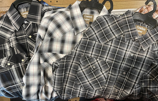 It doesn't get much anymore classic than a plaid pearl snap western shirt. Complete with two front flap pockets, pearl snap details in the vintage plaid pattern. These never go out of style, always a in style! Available in our Smyrna, TN shop just outside Nashville. Imported

Note: the Plaid colors Blue, Red, and Brown, or Black will always be the base color BUT the tones may change occasionally. The yokes ,snaps will be the same as well.

Details: Snaps, 2 Pockets, Yokes