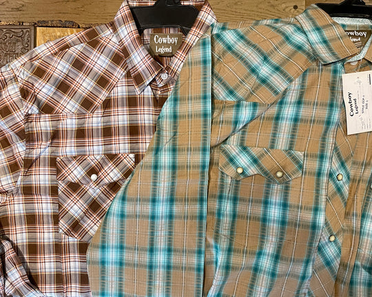 It doesn't get much anymore classic than a plaid pearl snap western shirt. Complete with two front flap pockets, pearl snap details in the vintage plaid pattern. These never go out of style, always a in style! Available in our Smyrna, TN shop just outside Nashville. Imported

Note: the Plaid colors Blue, Red, and Brown, or Black will always be the base color BUT the tones may change occasionally. The yokes ,snaps will be the same as well.

Details: Snaps, 2 Pockets, Yokes