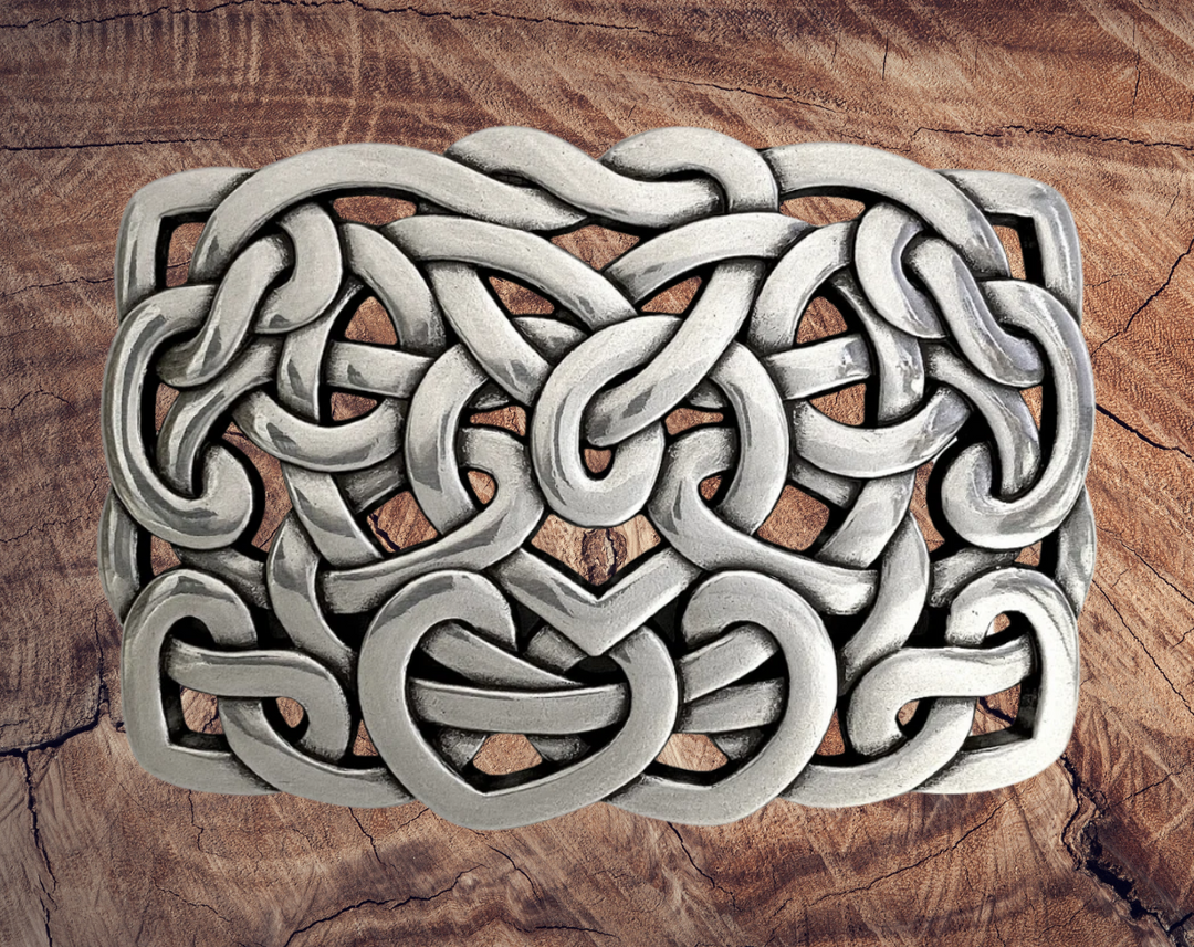 Get lost in the intricacy of Celtic and Nordic Knot patterns. These interconnected designs have their origins in Celtic culture, symbolizing the interconnectedness of all things. With their continuous and flowing lines, they have no beginning or end. Perfect for belts up to 1 1/2 inches. Come visit our store in Smyrna, TN, just a Knot away from downtown Nashville!

Approx. 3" x 4"
Imported