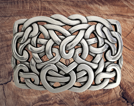 Get lost in the intricacy of Celtic and Nordic Knot patterns. These interconnected designs have their origins in Celtic culture, symbolizing the interconnectedness of all things. With their continuous and flowing lines, they have no beginning or end. Perfect for belts up to 1 1/2 inches. Come visit our store in Smyrna, TN, just a Knot away from downtown Nashville!

Approx. 3" x 4"
Imported